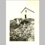 Unknown person in front of the bunkhouse at The Cash near Farmborough, Quebec.c1940. <br>The Cash is where the loggers got paid south of Farmborough, , QC, Canada.<br>Source: images/5DApr14/0005DApr14/ (72.37 KB)